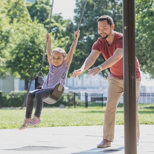 Common Questions- parents pushes little girl on swing