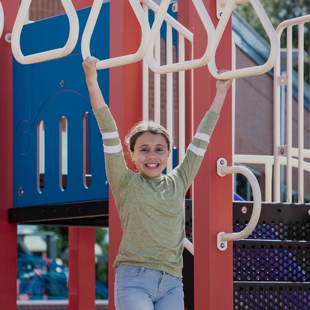 Common Questions-young girl plays in playground