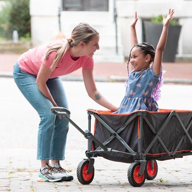 Common questions-caregiver pulls child in wagon