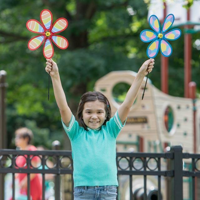 Common Question-Girl holding flower pinwheels