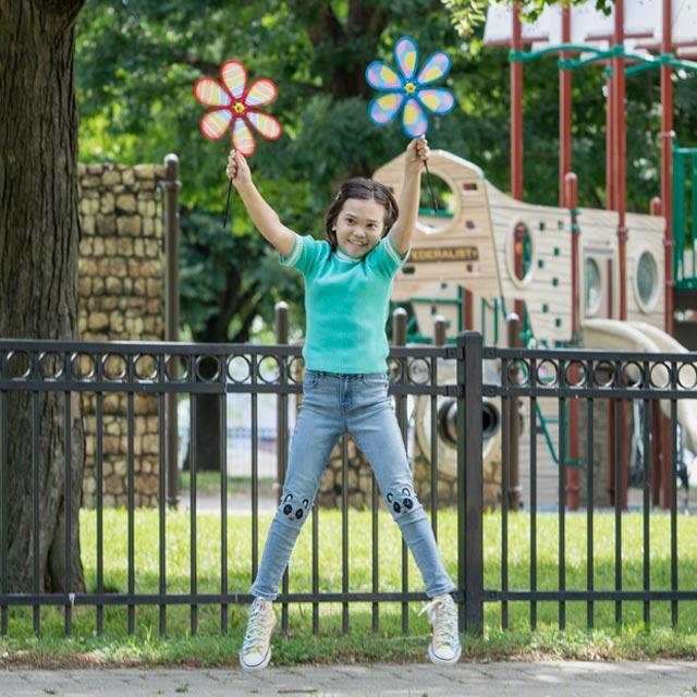 Common Questions-jumping girl with flower pinwheels