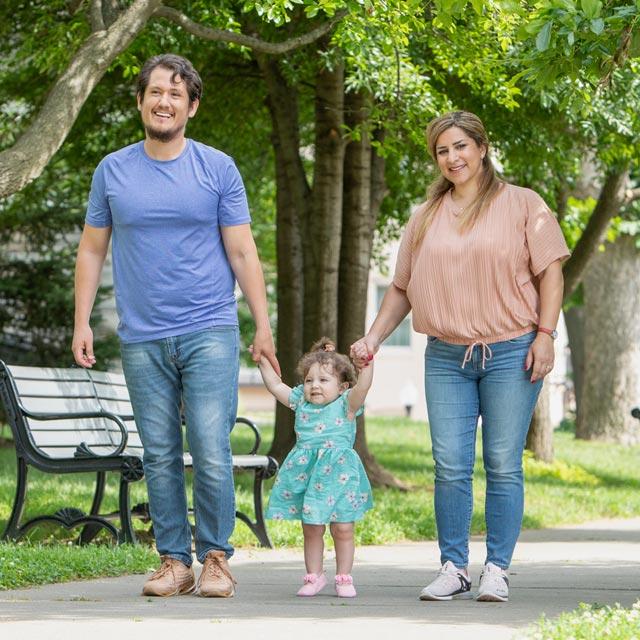 Common Questions-parents walk toddler daughter