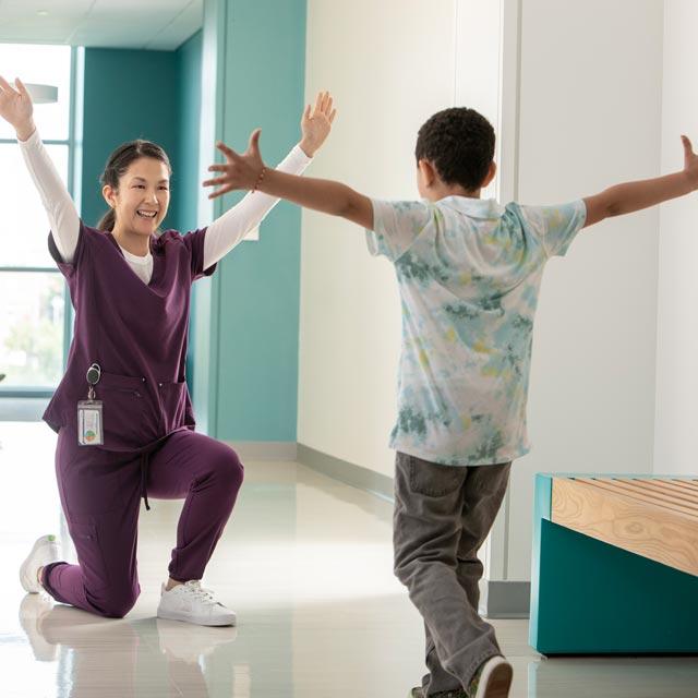 Common Questions- Boy and healthcare provider celebrating
