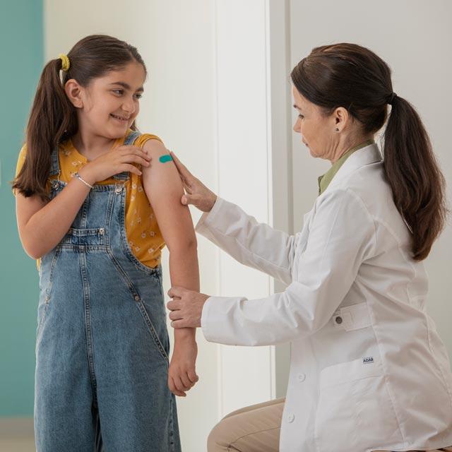 Common Questions-girl getting vaccinated at doctor's office